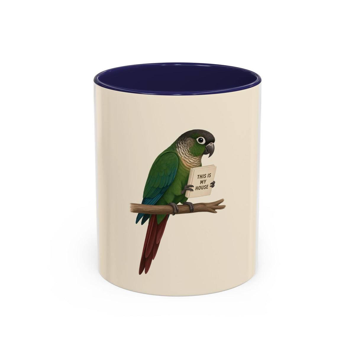 A ceramic mug with a white and cream-colored exterior and a blue interior, featuring a printed illustration of a green parrot perched on a branch holding a sign that reads 'THIS IS MY HOUSE'.